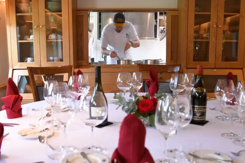 The dining room, the chef at work behind the window