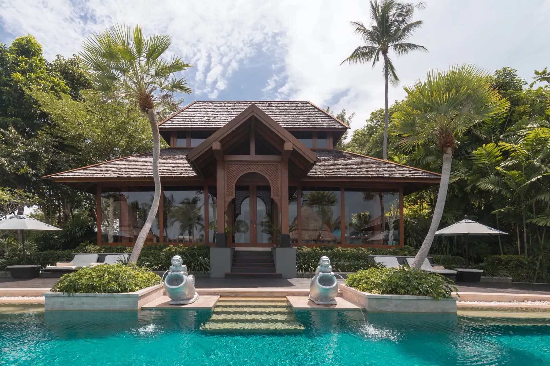 A villa at The Estates Samui, its pavilion and pool under the palms above Laem Yai Bay.