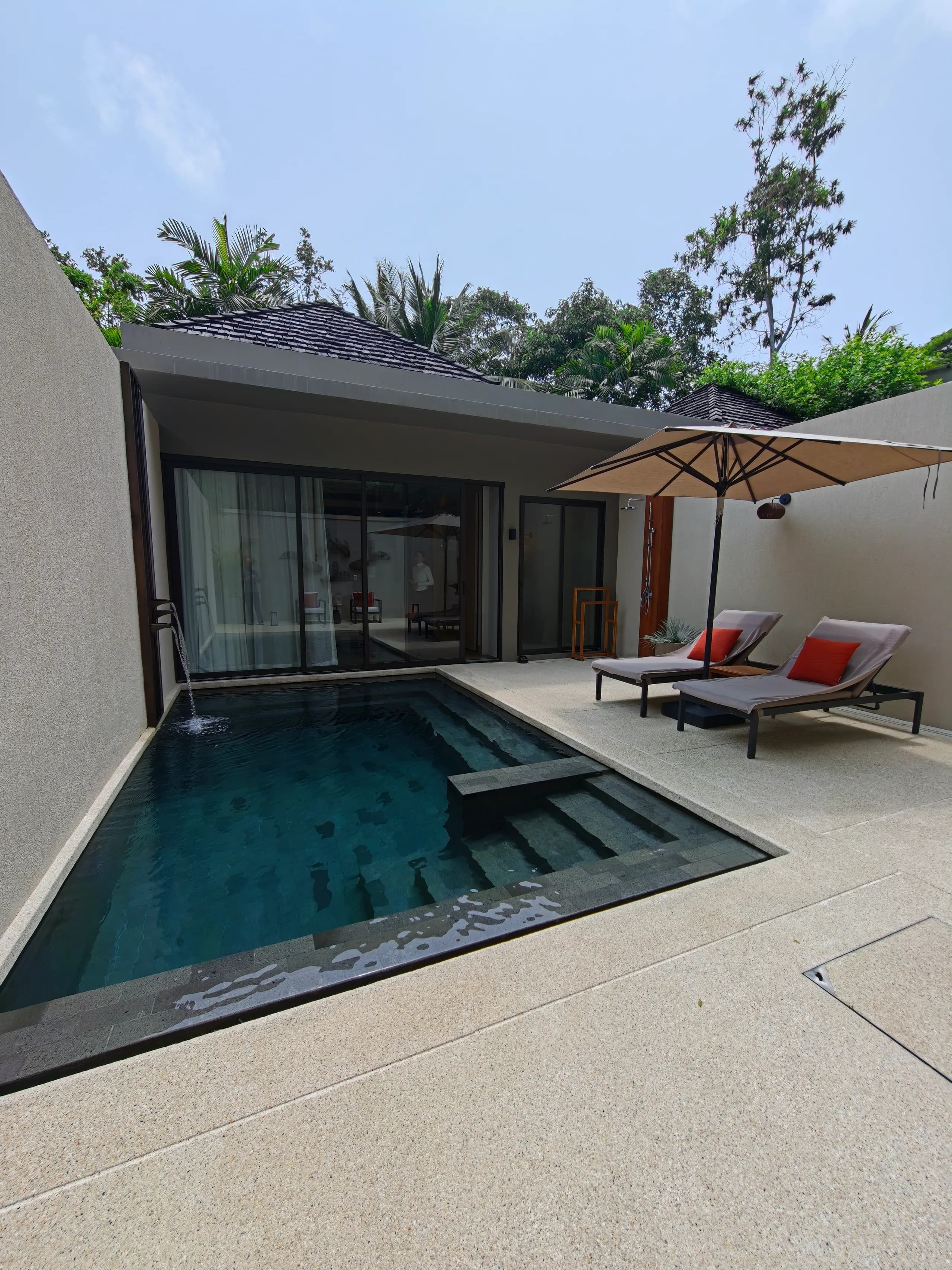 Private pool and sundeck in the walled courtyard of a renovated Deluxe Pool Villa at Anantara Layan Phuket