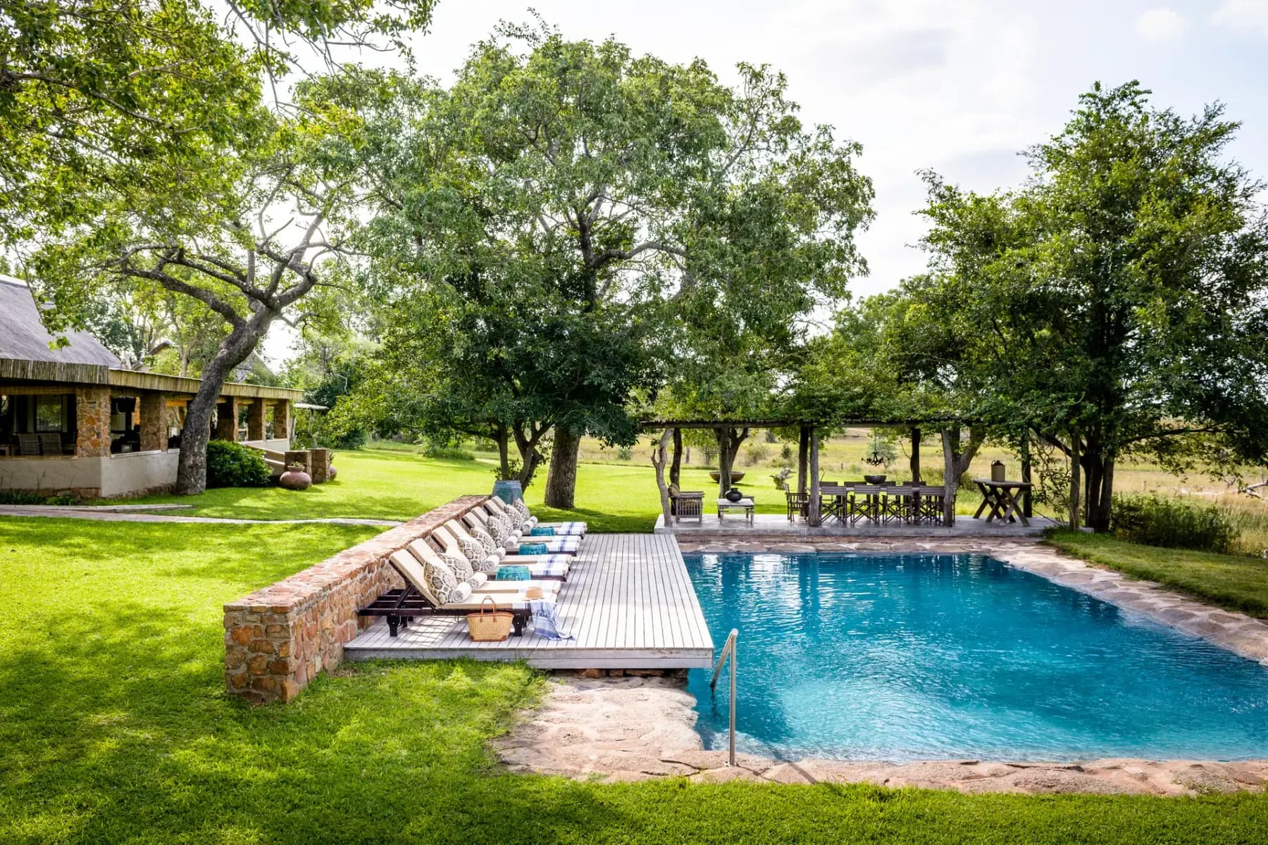 The lawn and pool at Singita Castleton