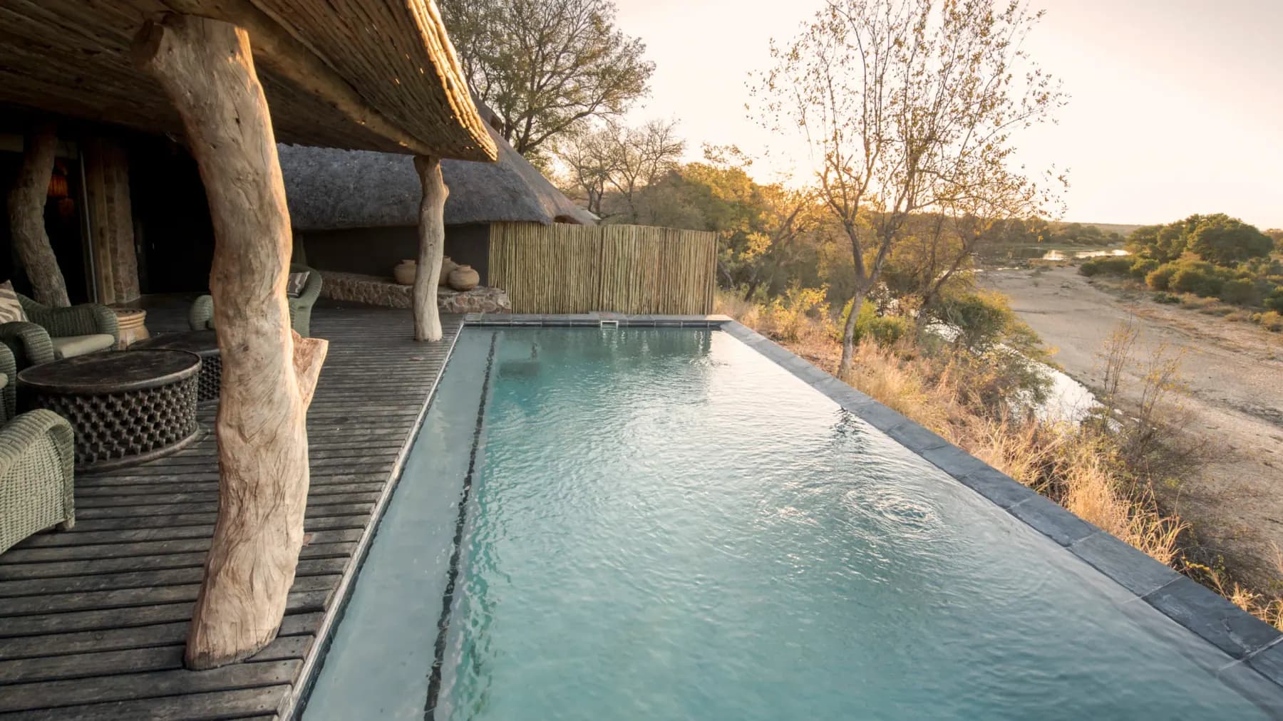 The pool deck of Singita Ebony Villa above the Sand River