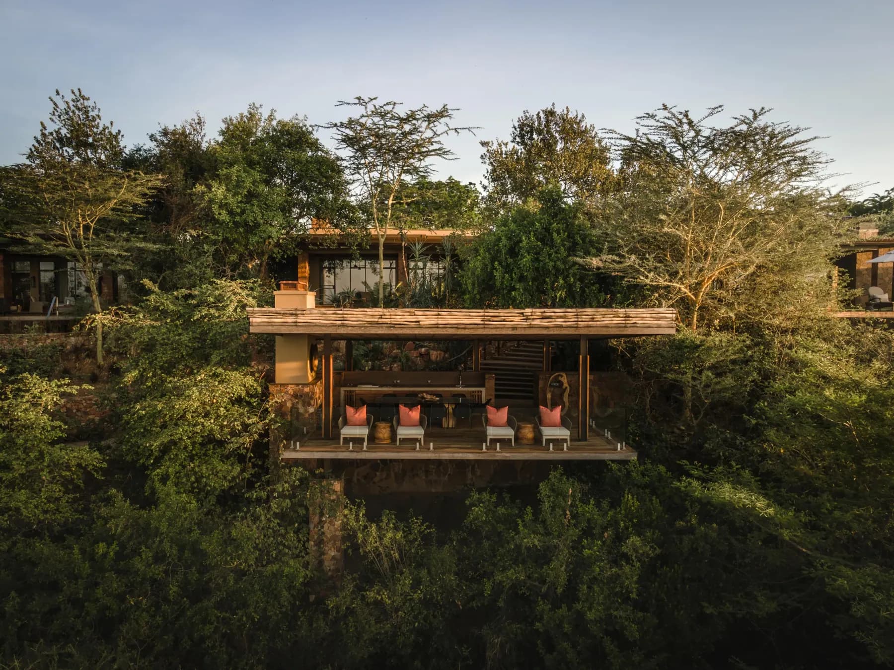 A suite deck at Singita Kilima among the trees