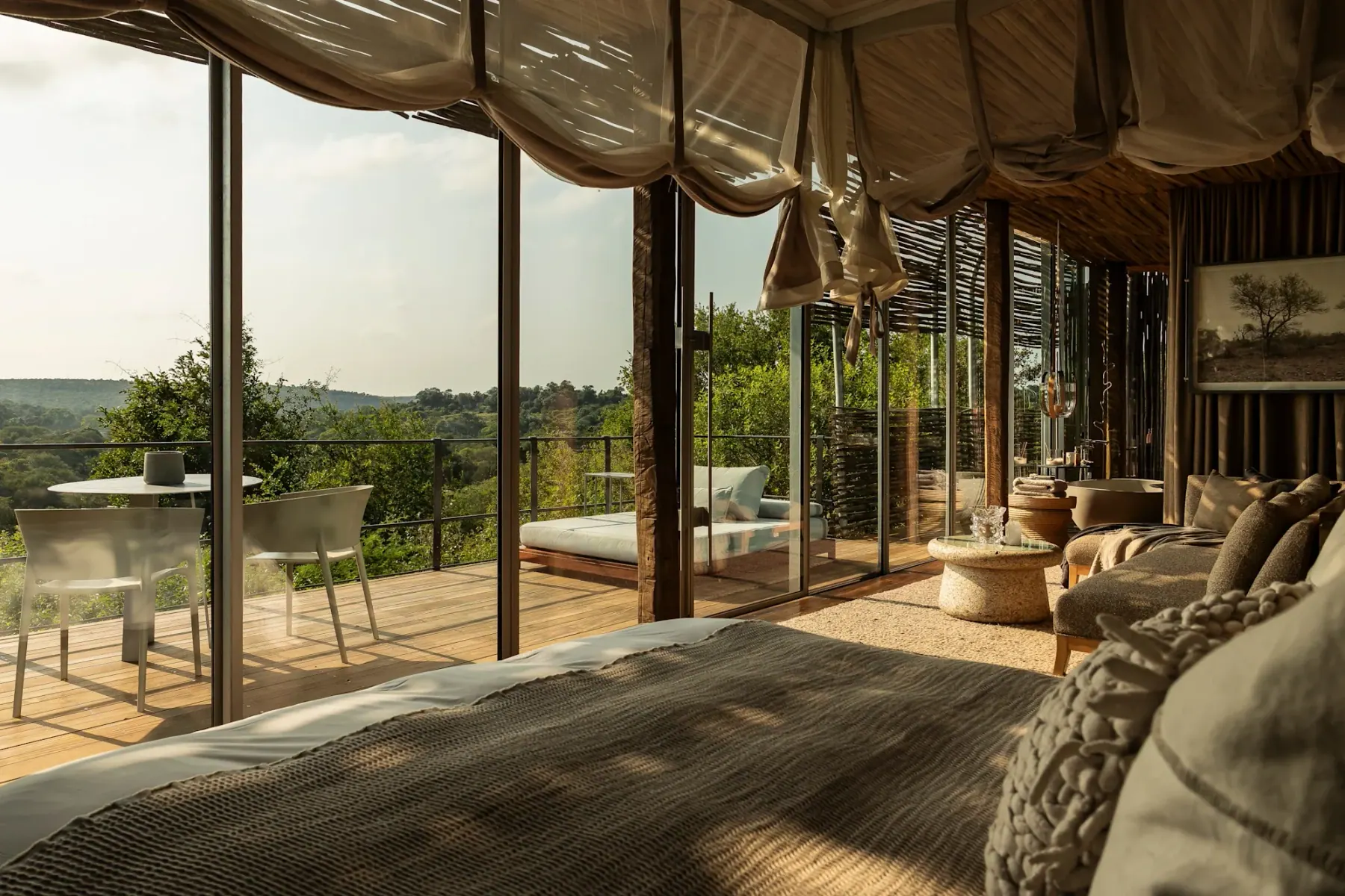 A glass-walled suite at Singita Lebombo Lodge, open to the Kruger bush