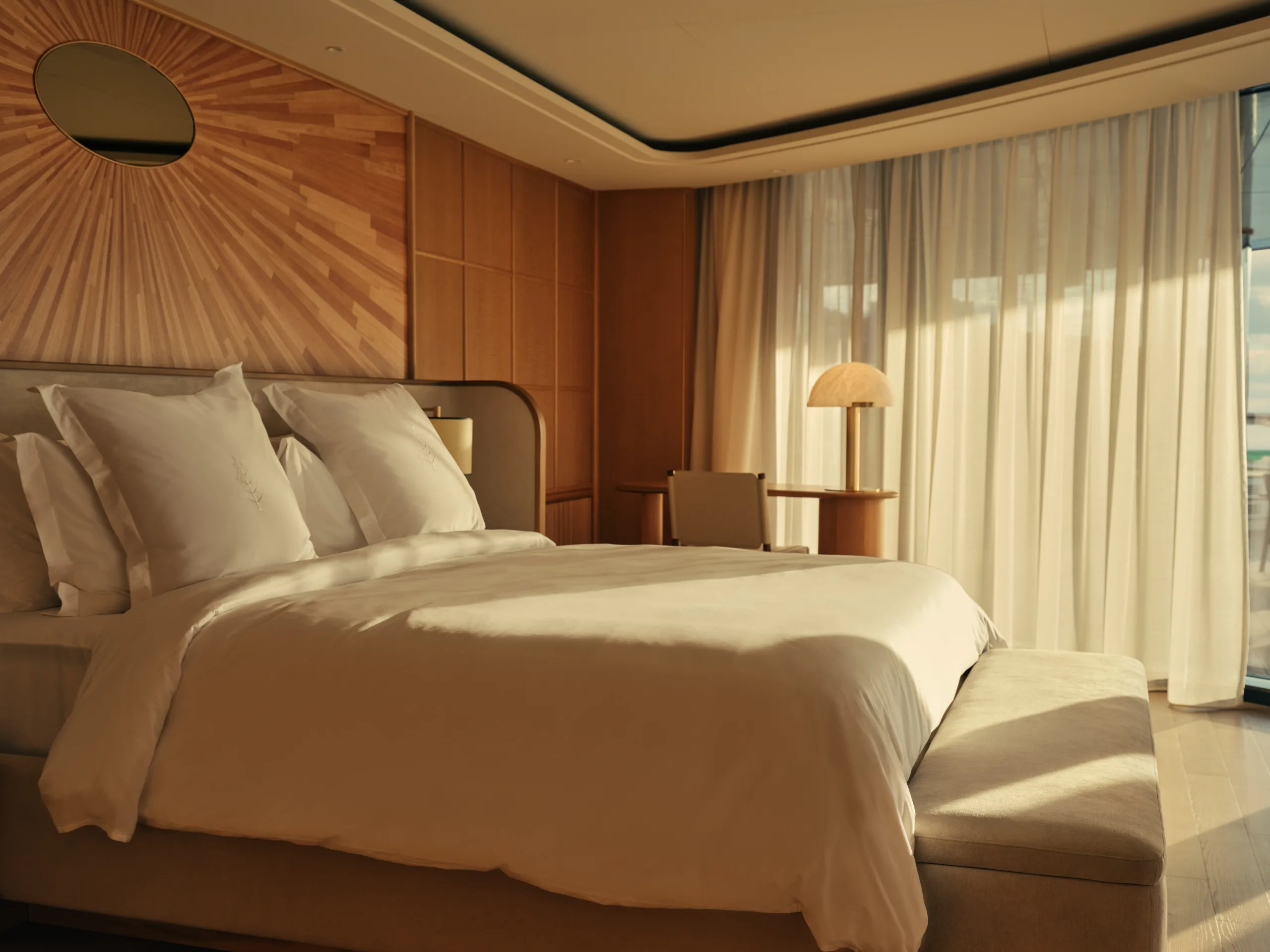 The Loft Suite bedroom aboard Four Seasons I, with a marquetry sunburst headboard