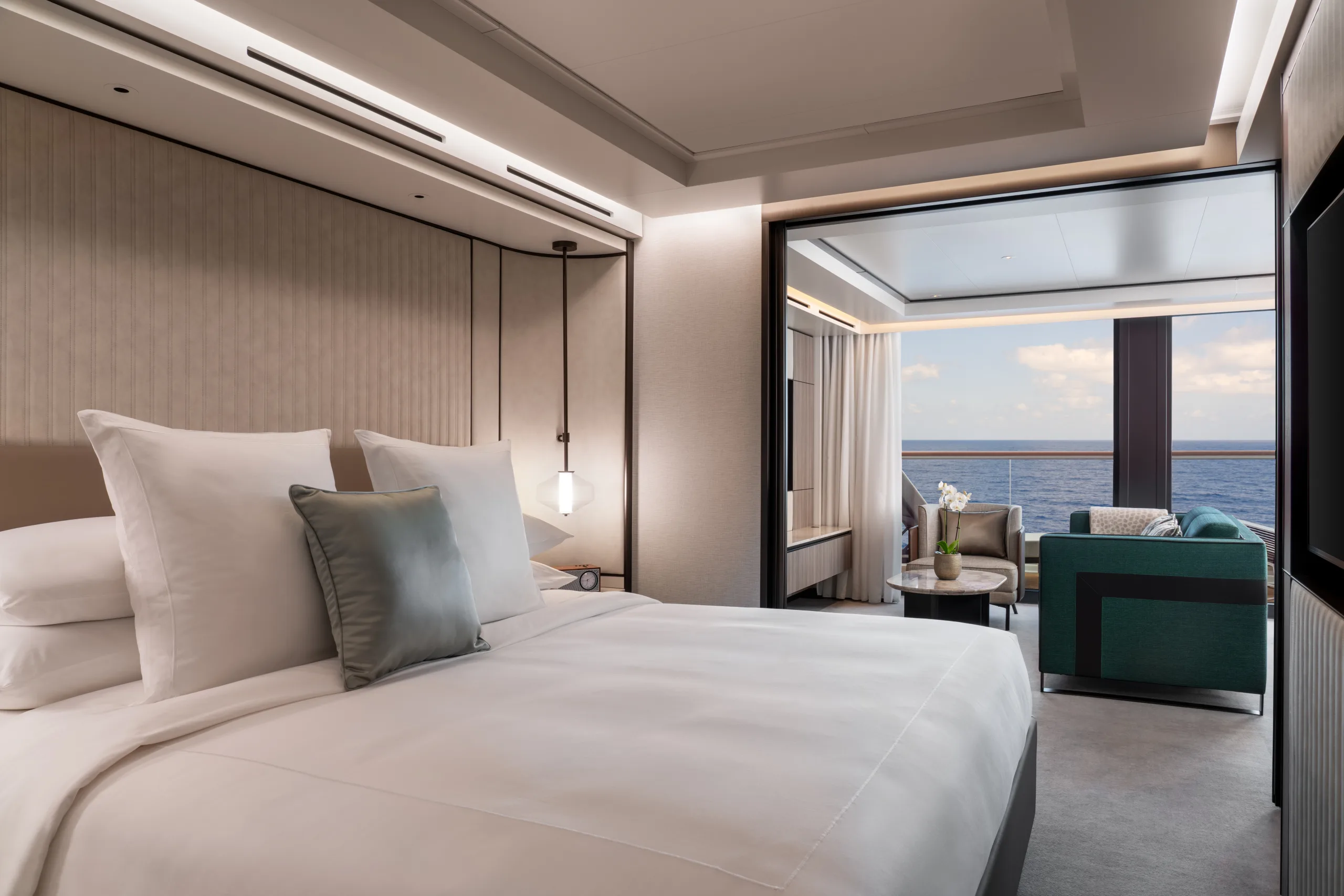 A Grand Suite aboard Ilma, the bedroom opening through to the living area and terrace