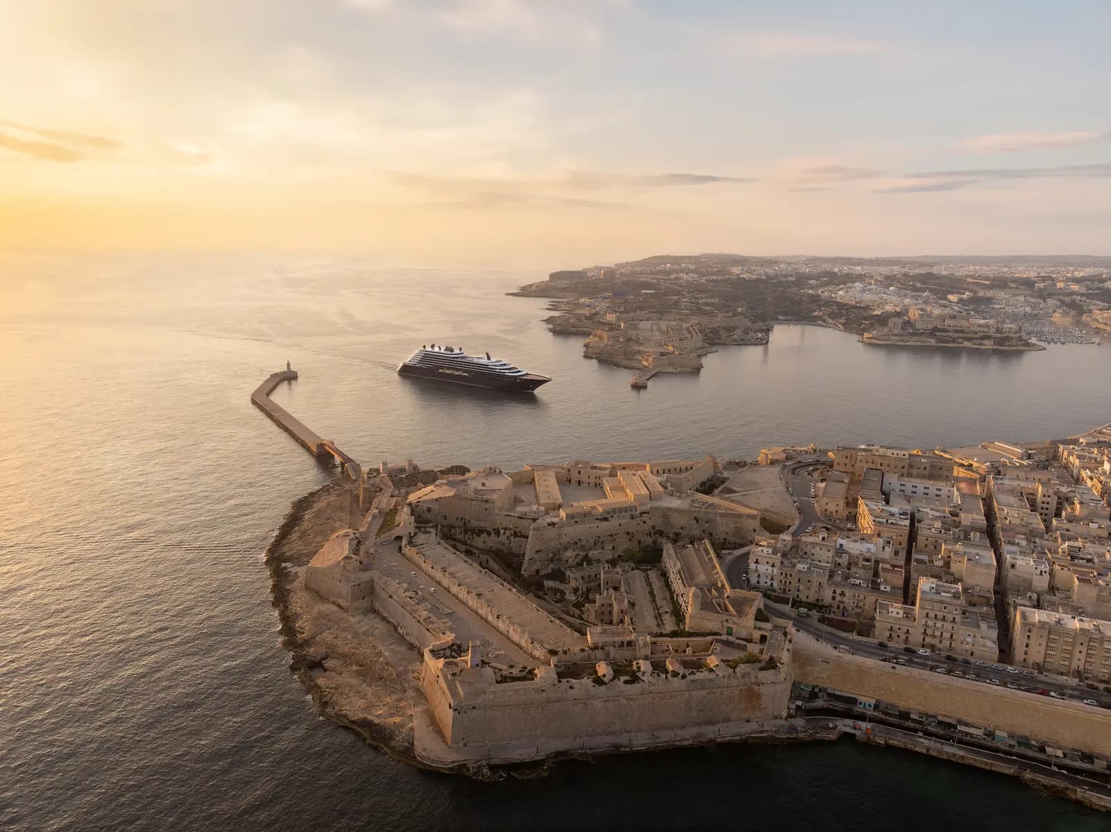 Ilma at anchor off Valletta at sunset, seen from the air over the fortified point of the Grand Harbour