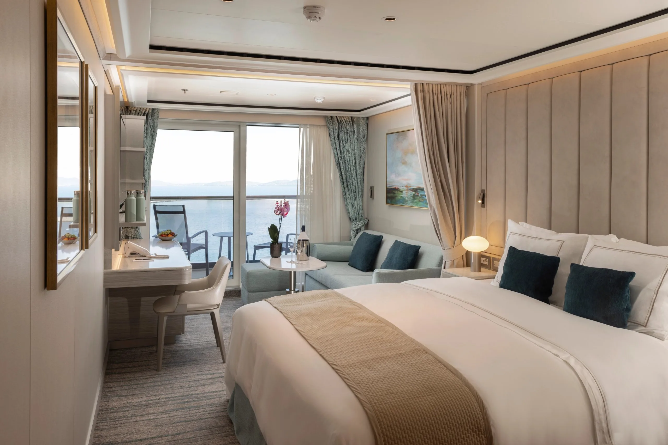 A suite aboard Silver Nova with a sitting area and private balcony