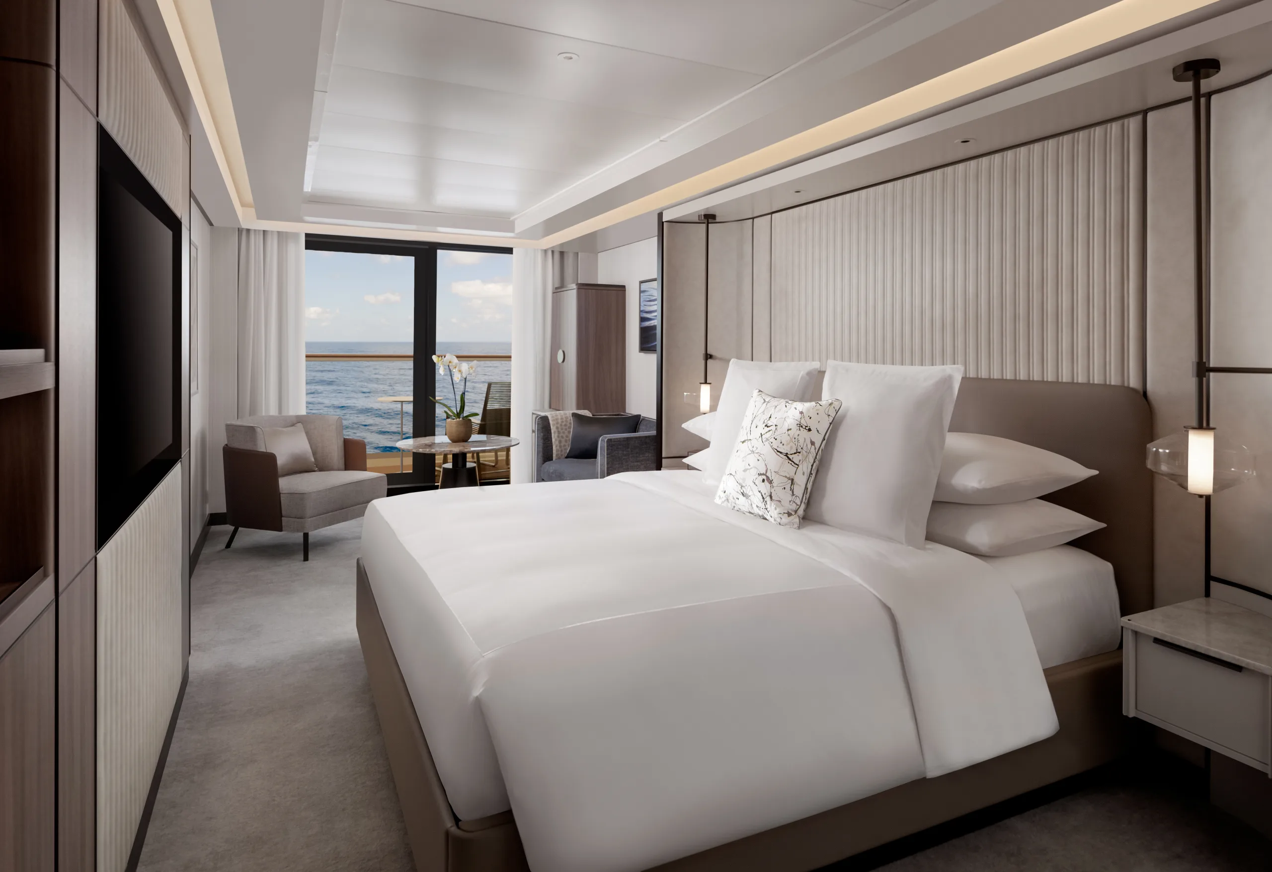 A Terrace Suite aboard Ilma, the bed facing sliding doors onto the private terrace